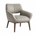 Sillón de cuero sintético beige con patas de madera maciza